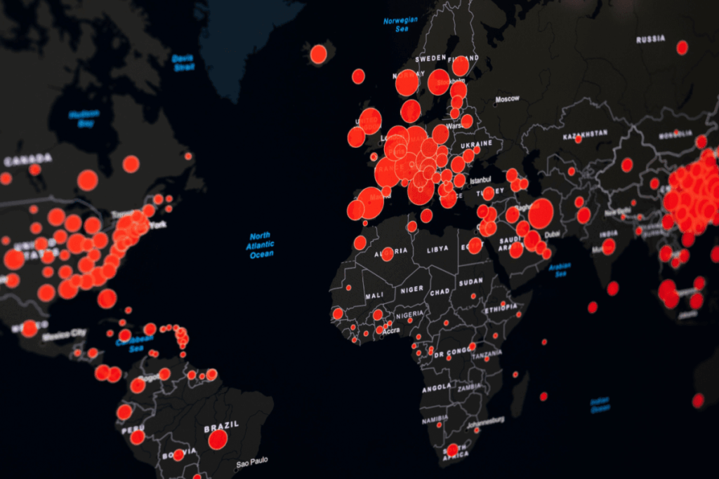 A GIS-generated world map shows COVID-19 hotspots. 