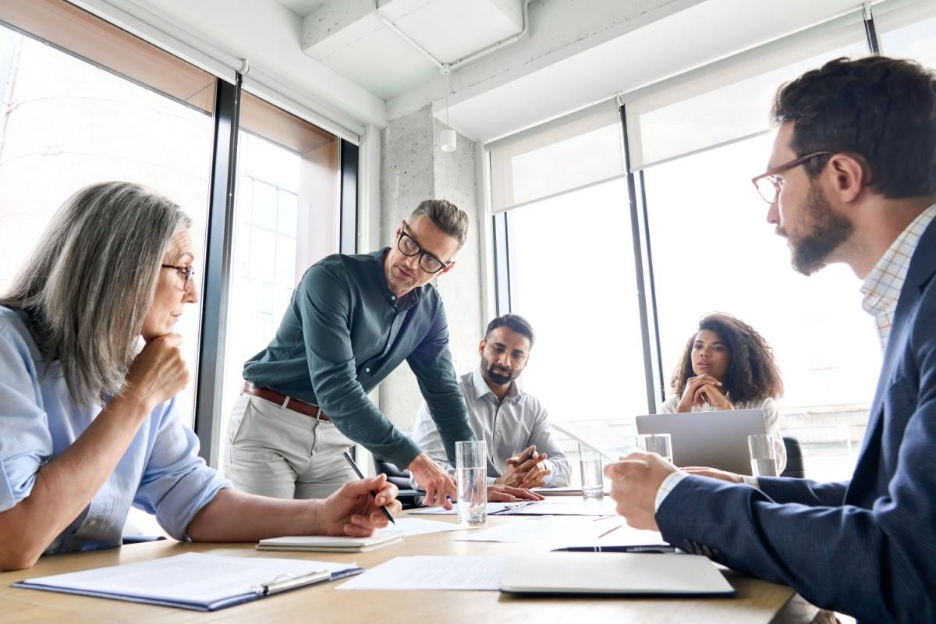 Business team discussing international strategy during a meeting in a modern office. 