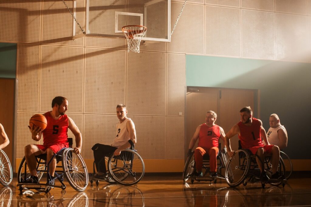 Wheelchair basketball players compete on an indoor court.